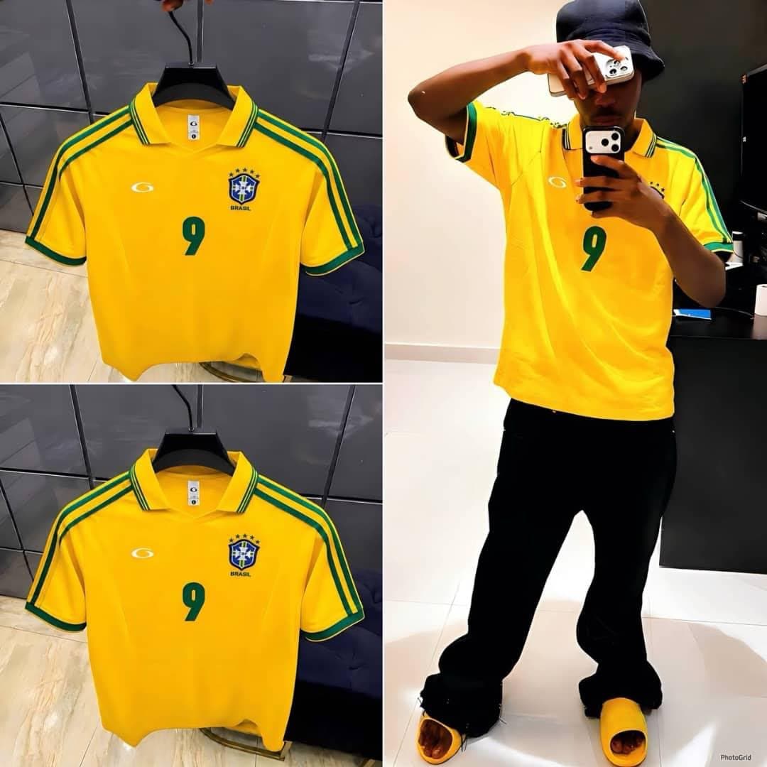 Front and back views of the yellow Brazil #9 polo jersey on hangers.