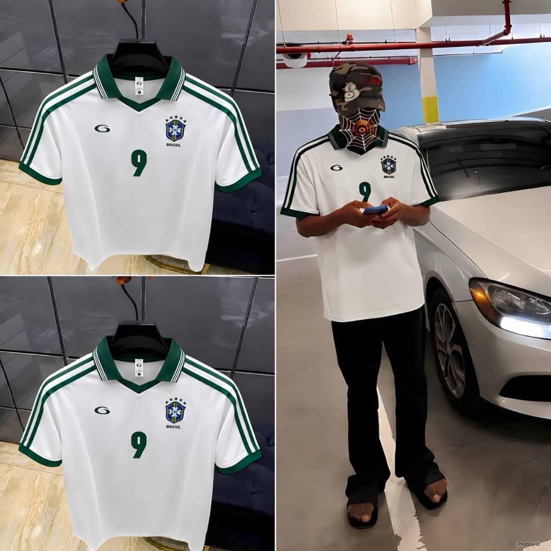 Front and back views of the white Brazil #9 polo jersey on black hangers.