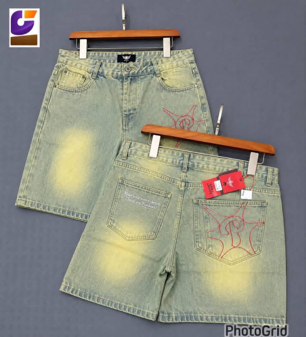 Blue denim shorts with white graffiti and text prints, two views.