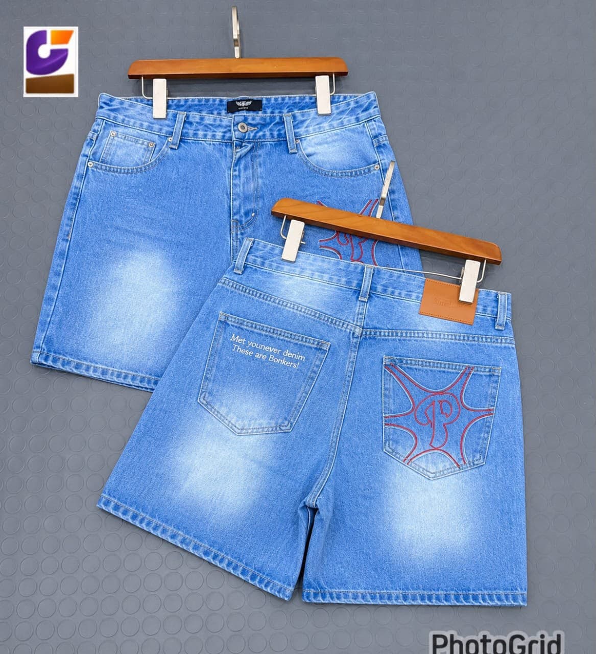 Light blue distressed denim shorts with patches, chains and rips.