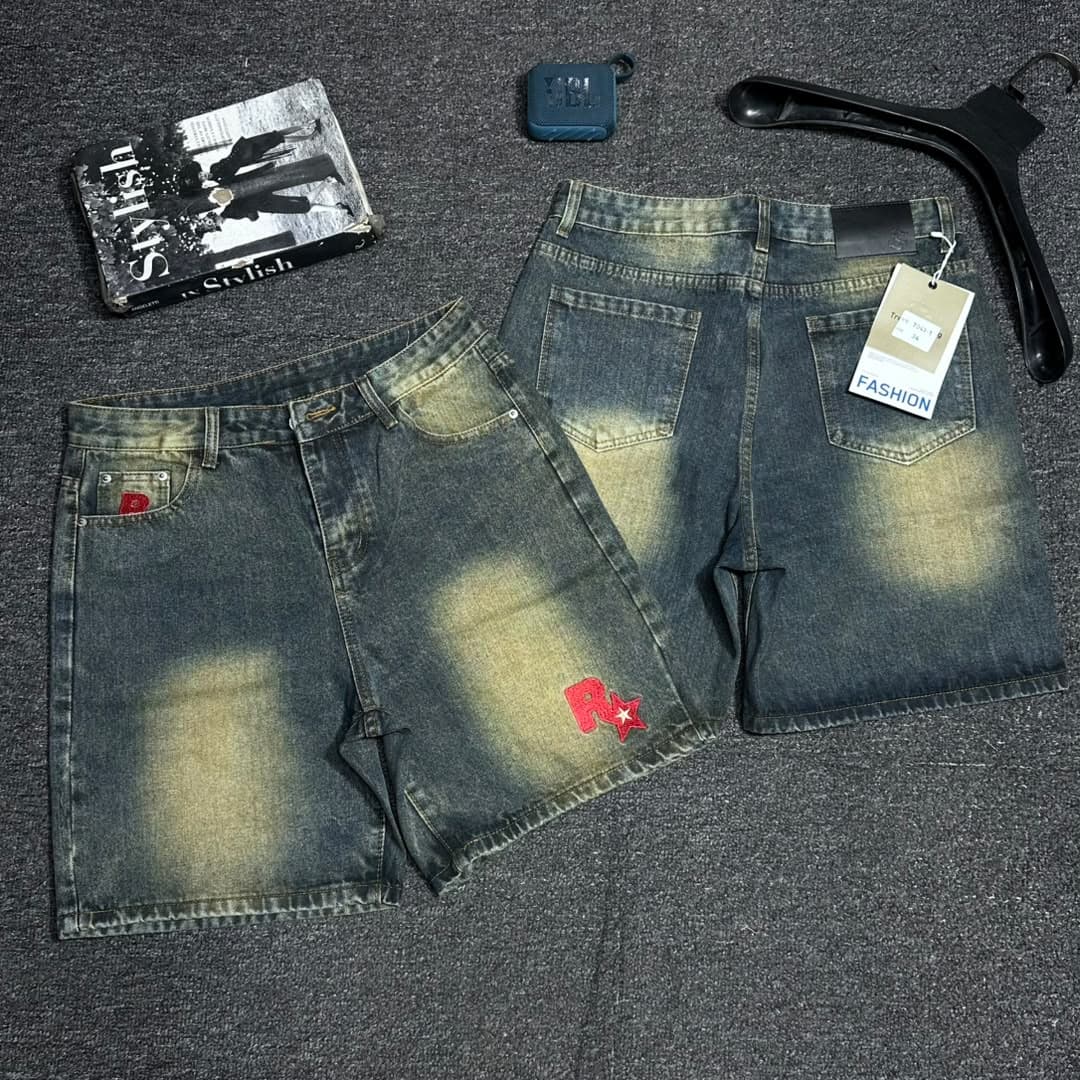 Light blue denim shorts with red DIESEL embroidery on front and back.