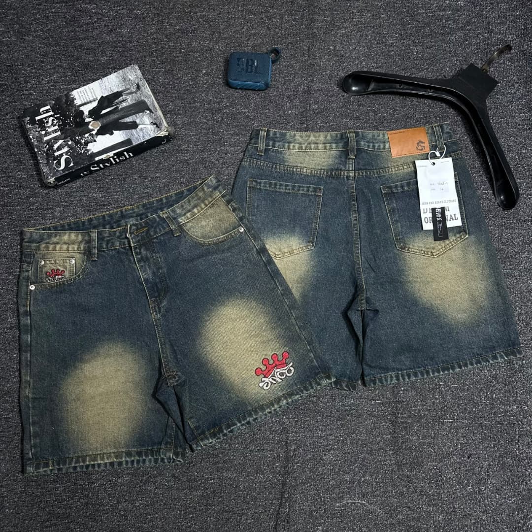 Faded blue denim shorts with red crown and since patch.