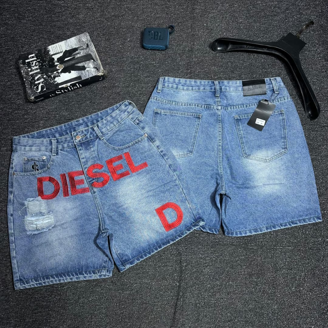 Faded denim shorts with red R and star embroidery.
