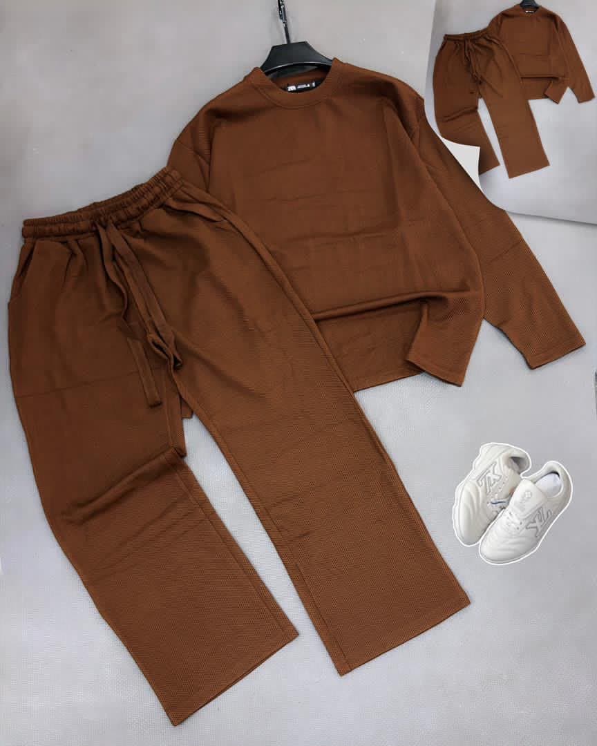 Brown textured knit two-piece set with long sleeve top, pants and white sneakers.