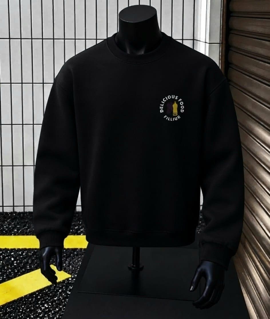 Mannequin wearing black sweatshirt with circular logo print on chest.