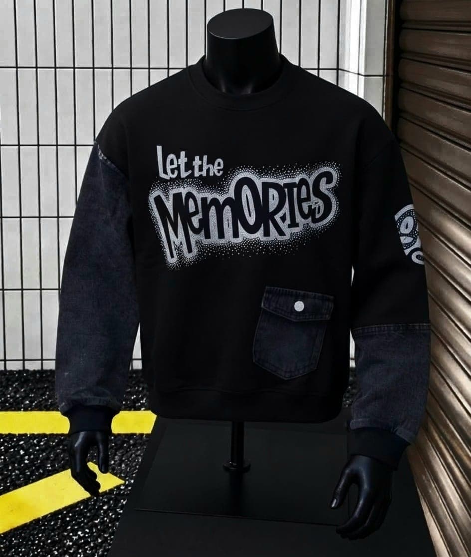 Mannequin wearing black sweatshirt with denim sleeves and Let the Memories graphic.