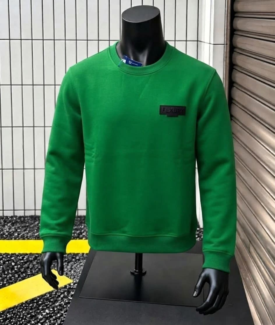 Mannequin wearing bright green sweatshirt with FLY OFF logo on chest.