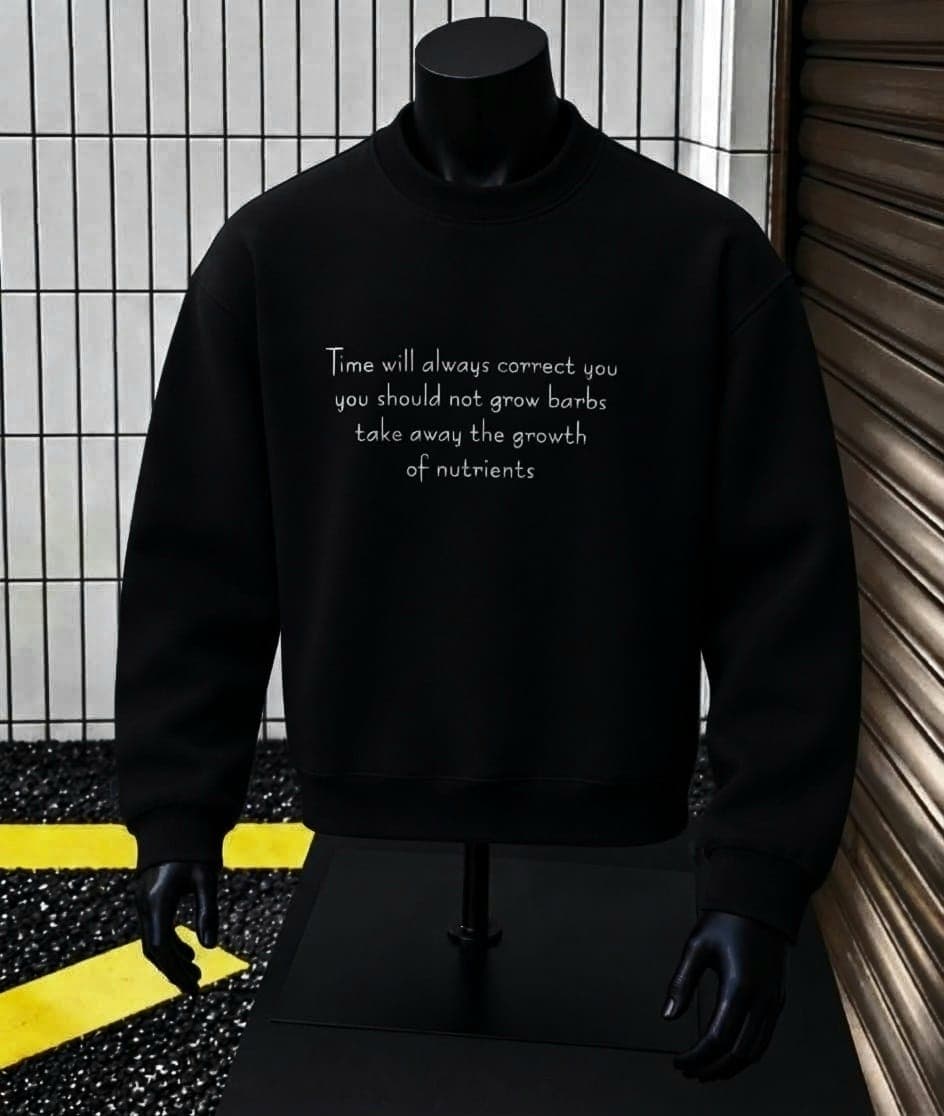 Mannequin wearing black crewneck sweatshirt with white text quote print on chest.