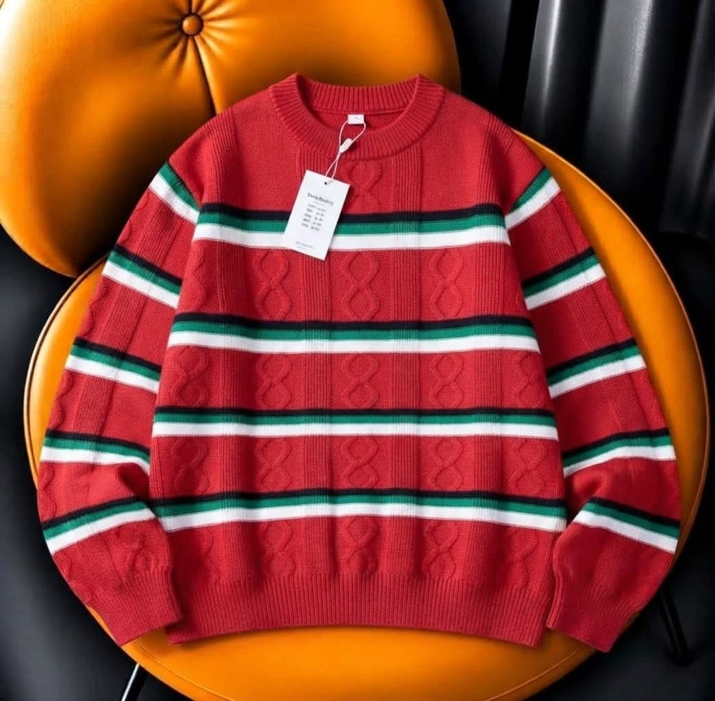 Cream and blue LV monogram fuzzy knit sweater on orange chair.