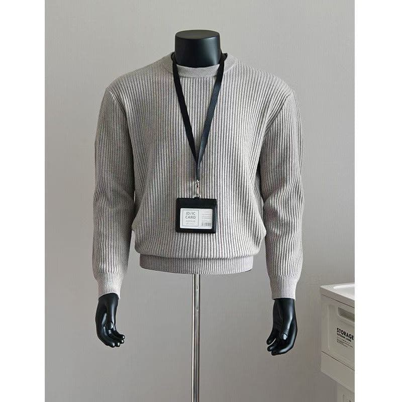 Light gray ribbed knit crewneck sweater on mannequin with lanyard.