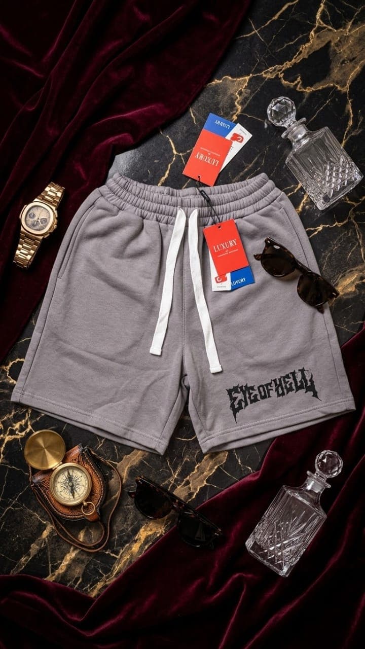 Gray fleece shorts with black EYE OF HELL gothic print surrounded by luxury props and velvet.