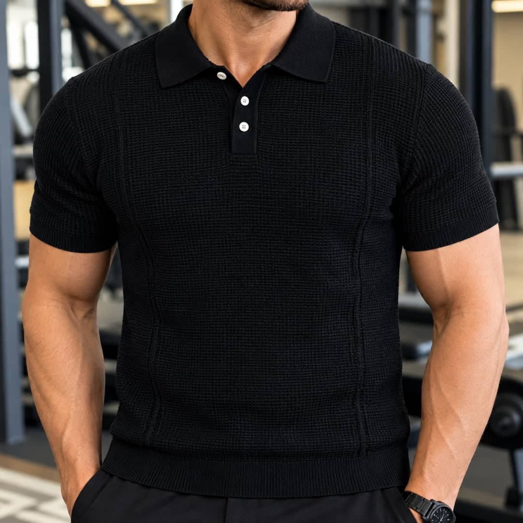Man wearing black waffle knit polo shirt.
