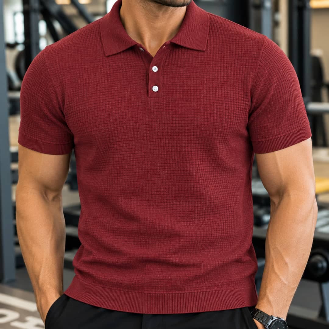 Man wearing burgundy waffle knit polo shirt.