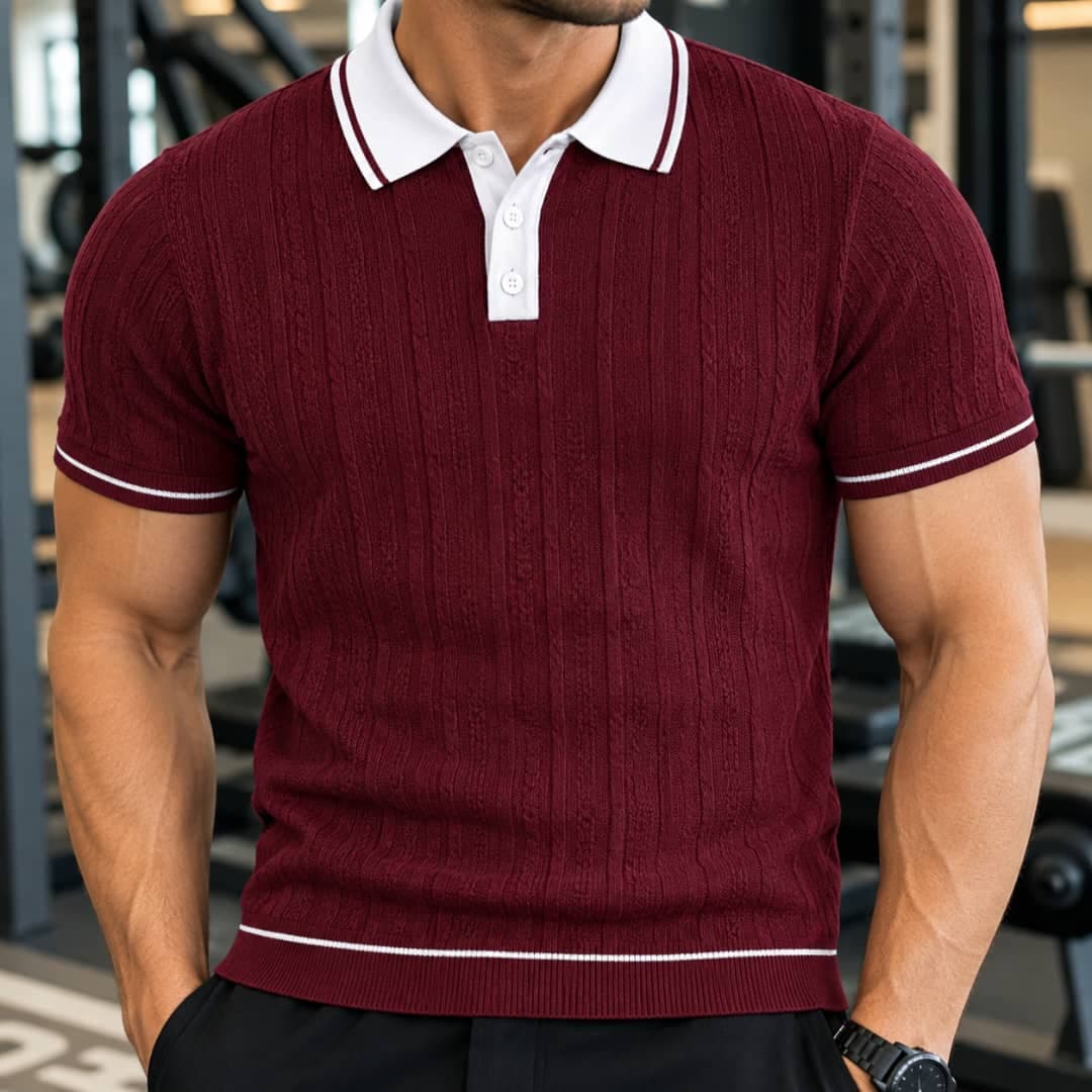 Man wearing burgundy ribbed polo shirt with white contrast collar and trim.