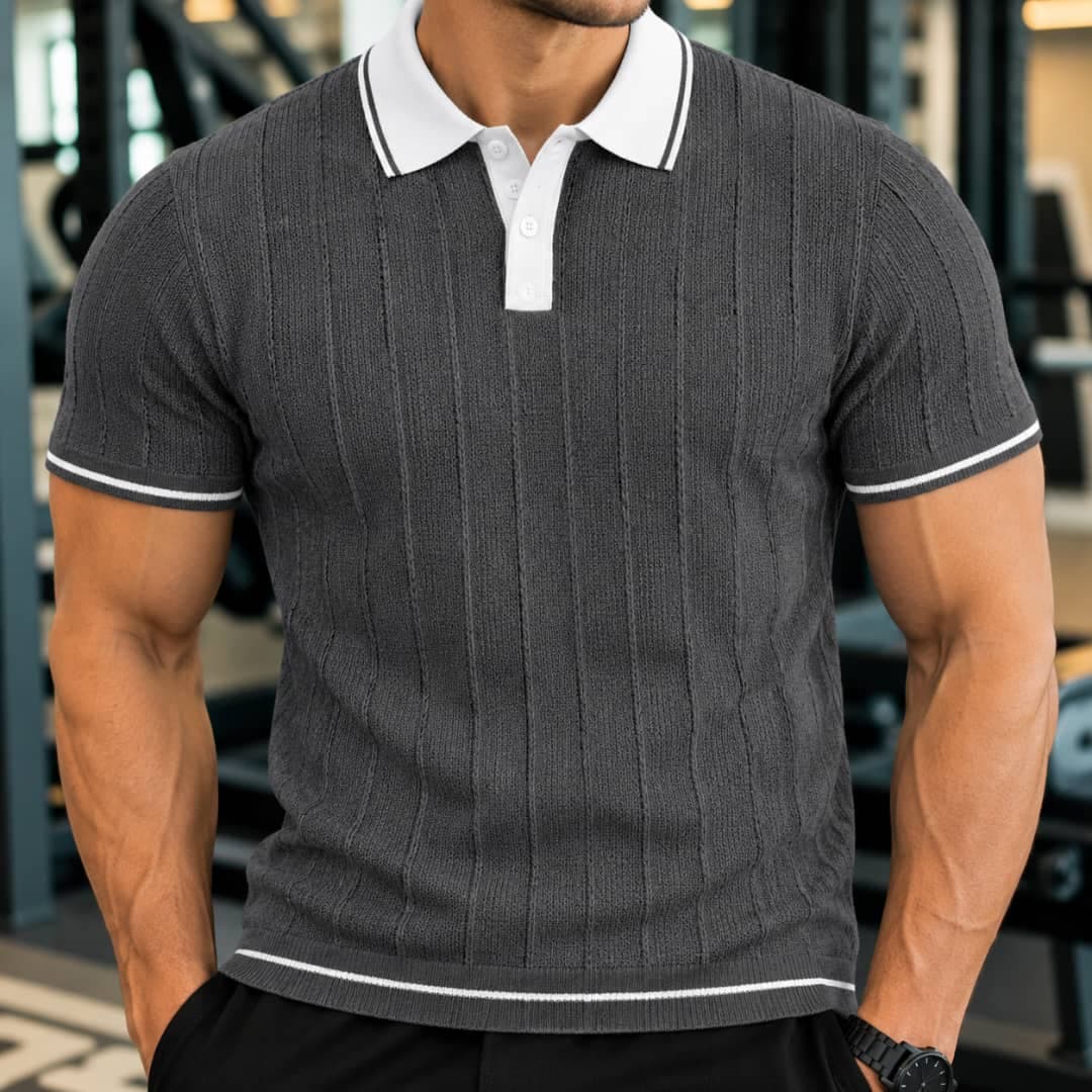 Man wearing gray ribbed polo shirt with white contrast collar and trim.