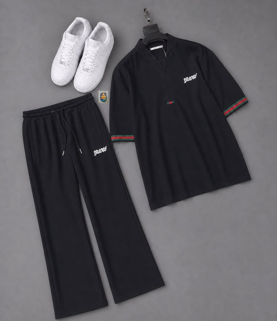 Man modeling the black Gucci two-piece set outdoors wearing a blue NY cap, with flat lays of the black top and trousers.
