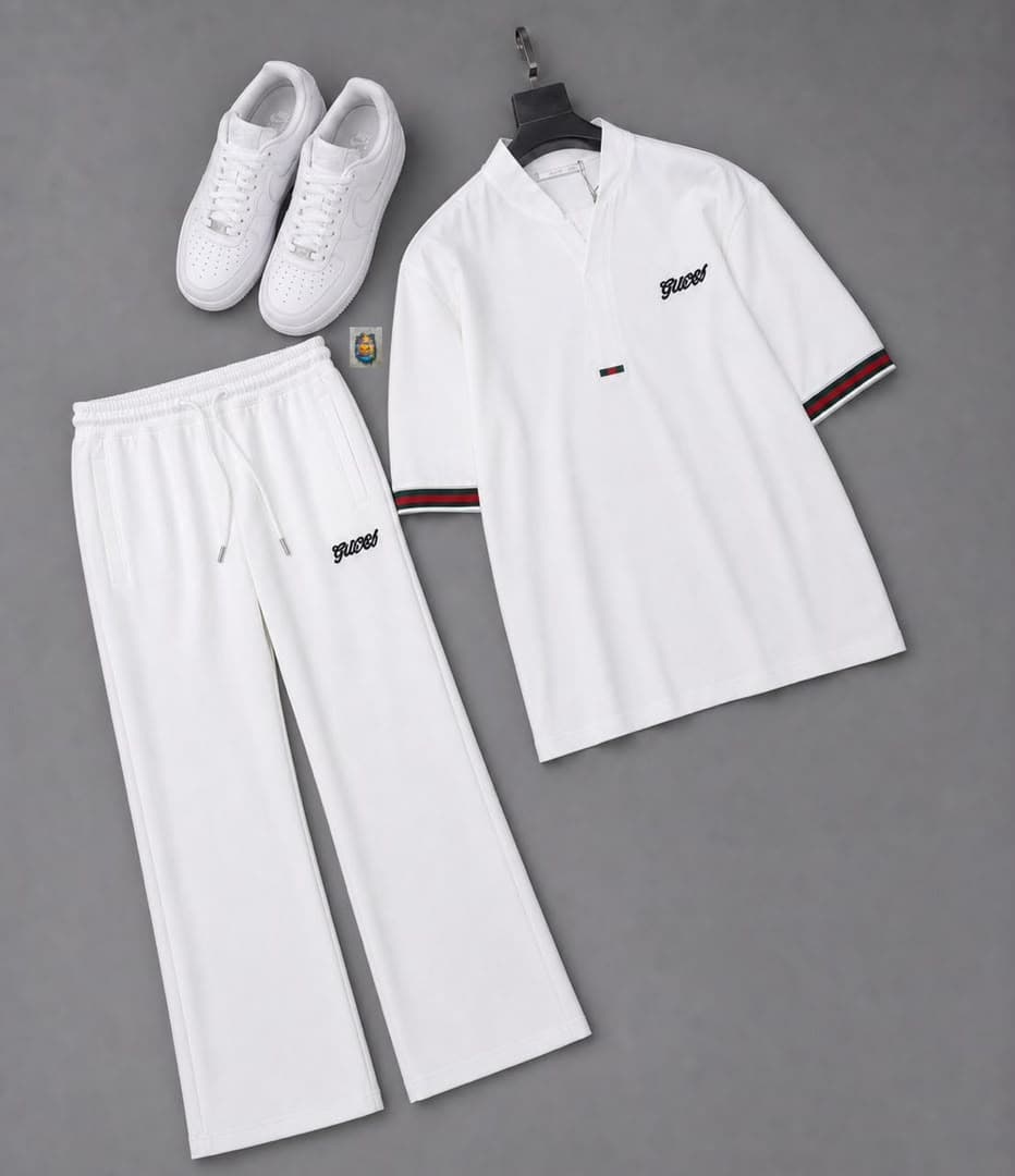 Man wearing white Gucci two-piece set with additional flat lay views of the white V-neck top and trousers.