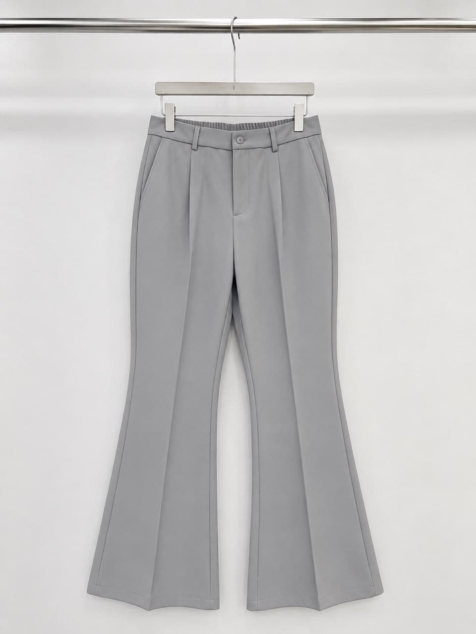 Gray high-waisted flare trousers.