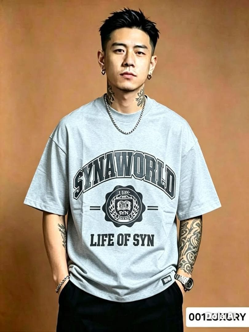 Man posing front-on in gray SYNAWORLD Life of Syn oversized graphic T-shirt with hands in pockets.