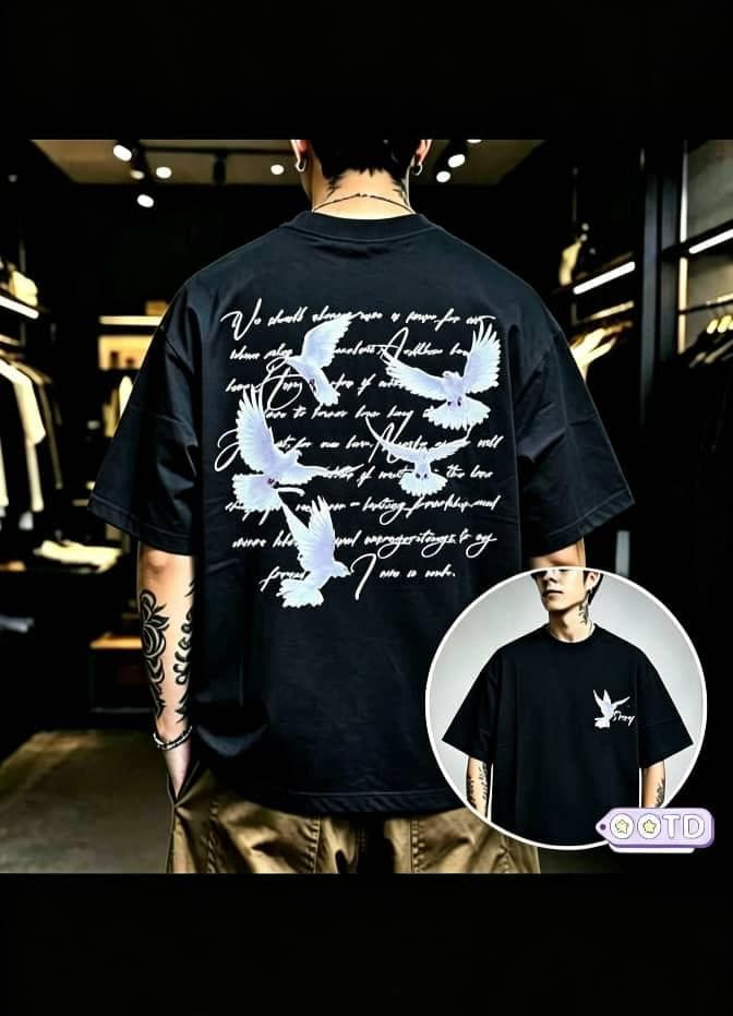 Model from behind in black oversized T-shirt with doves and cursive text graphic on back, circular front inset.