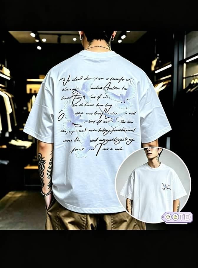 Model from behind in white oversized T-shirt with doves and cursive text graphic on back, circular front inset.