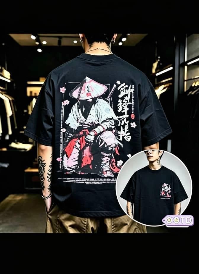 Model from behind in black oversized T-shirt with large samurai warrior graphic, Japanese text and cherry blossoms on back, circular front inset.