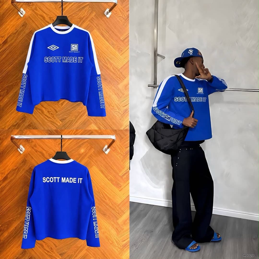 Blue Scott Made It cropped long sleeve sweatshirt with white accents in flat lay and worn by model.