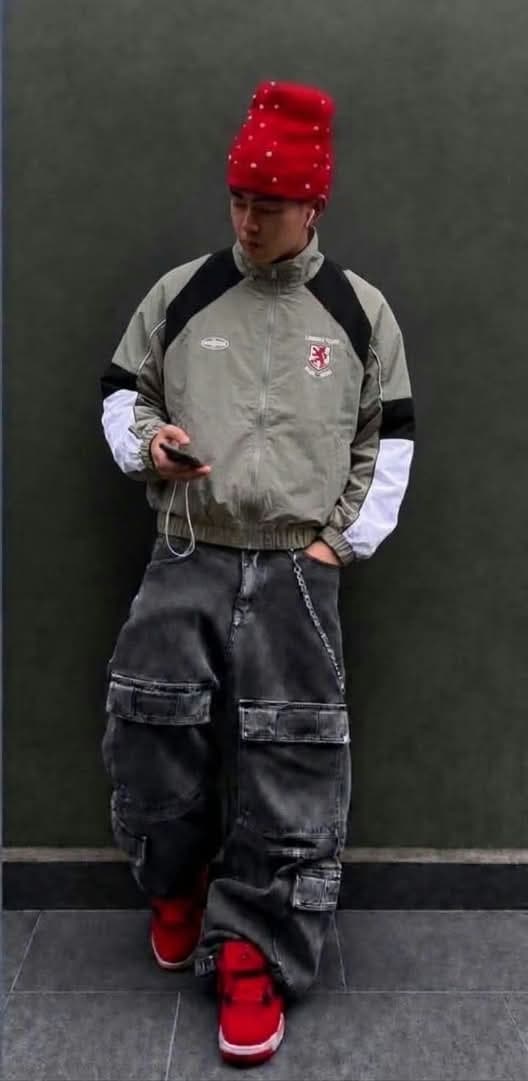 Olive colorblock crest track jacket with black shoulders and white sleeves.