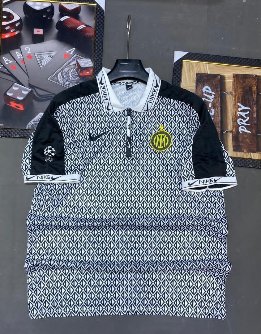 Patterned black and white Nike Inter Milan retro jersey with zip collar.