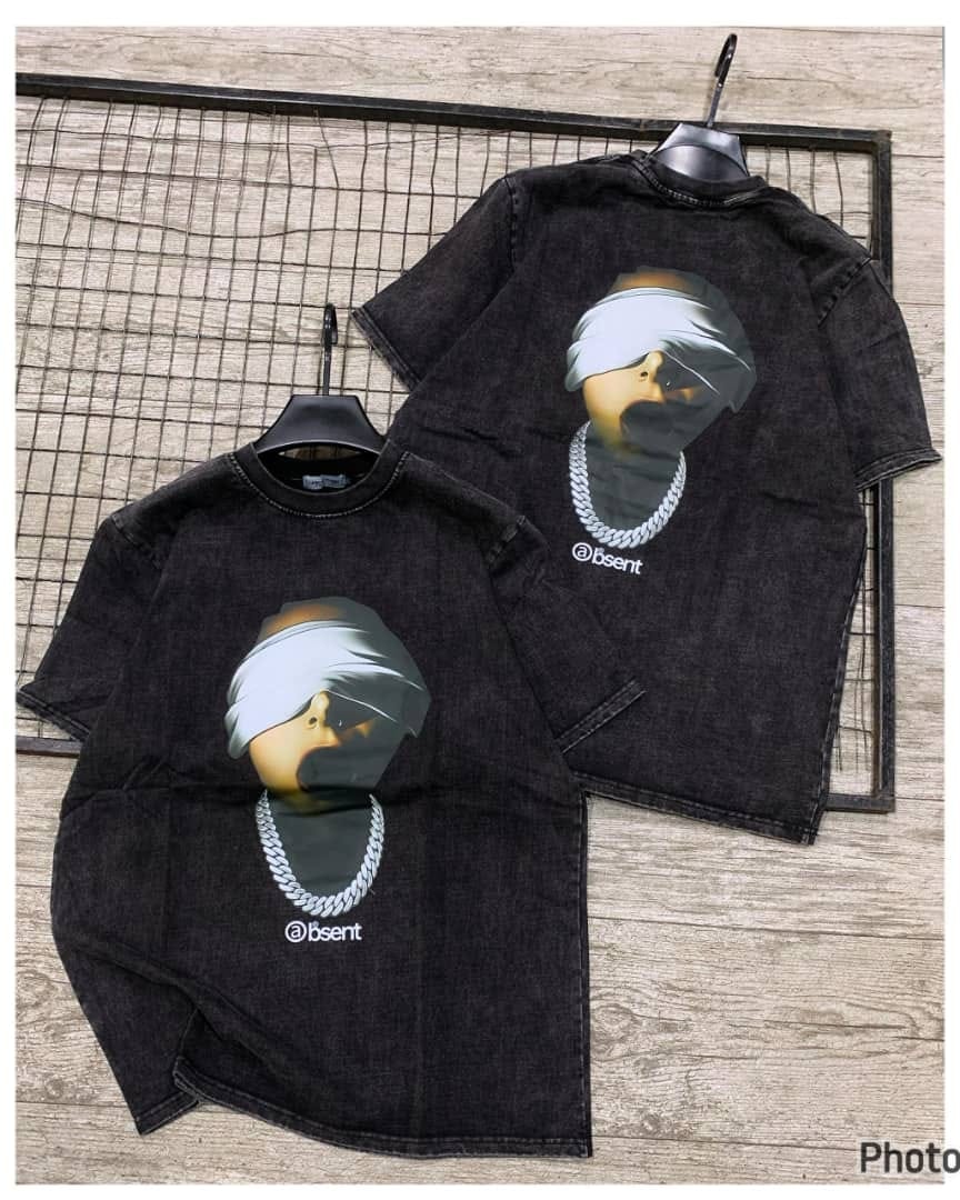Front and back views of black stonewashed t-shirt with masked figure and @bsent graphic.