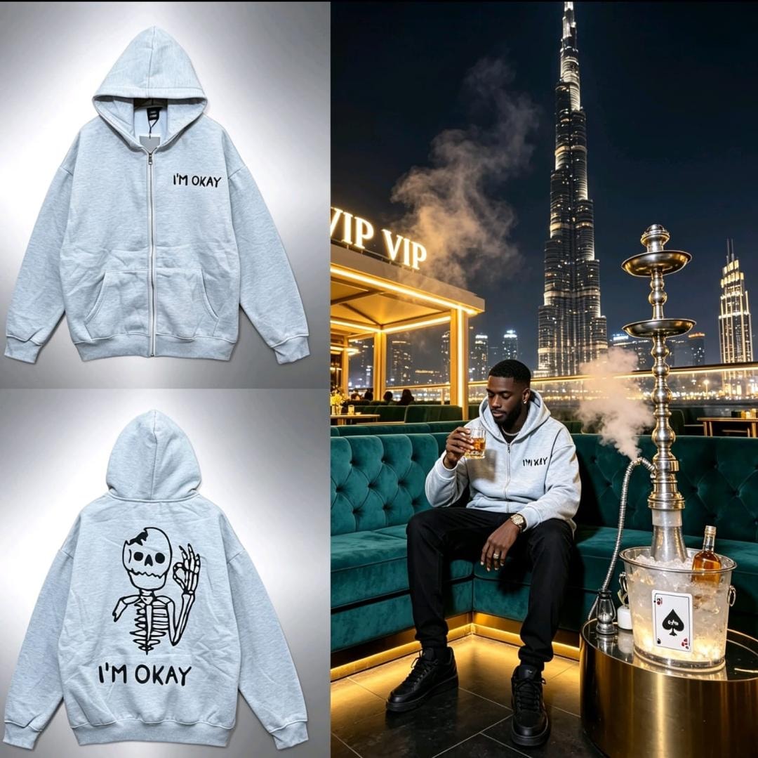 Light gray zip-up hoodie with I'm Okay text and skeleton graphic on back, shown in flatlay and lifestyle shot.