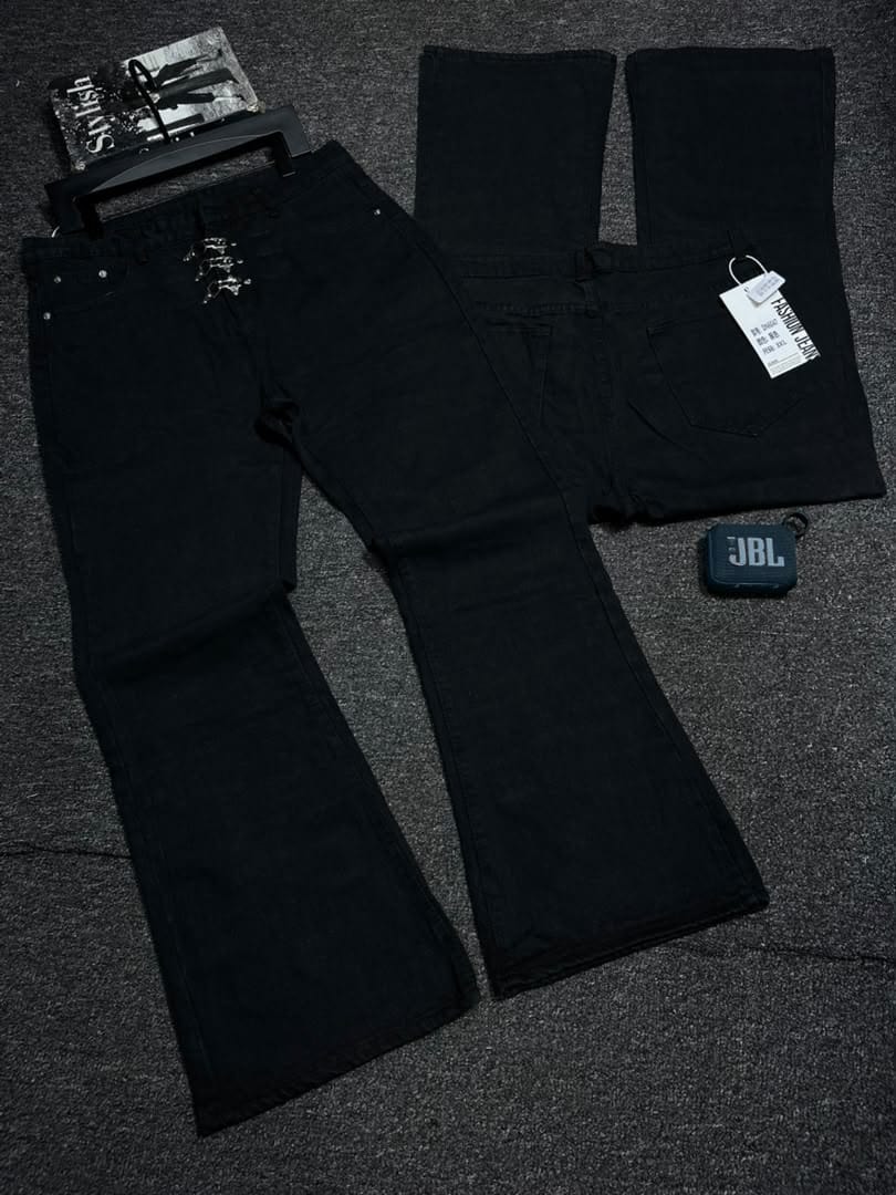 Black jeans with lace-up front chains and back view displayed with accessories.