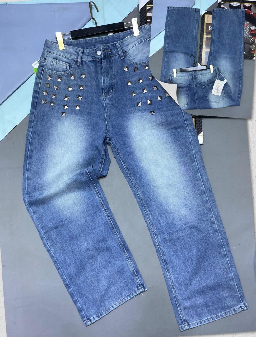 Blue jeans with silver pyramid studs on front pockets and waist, with inset back view.