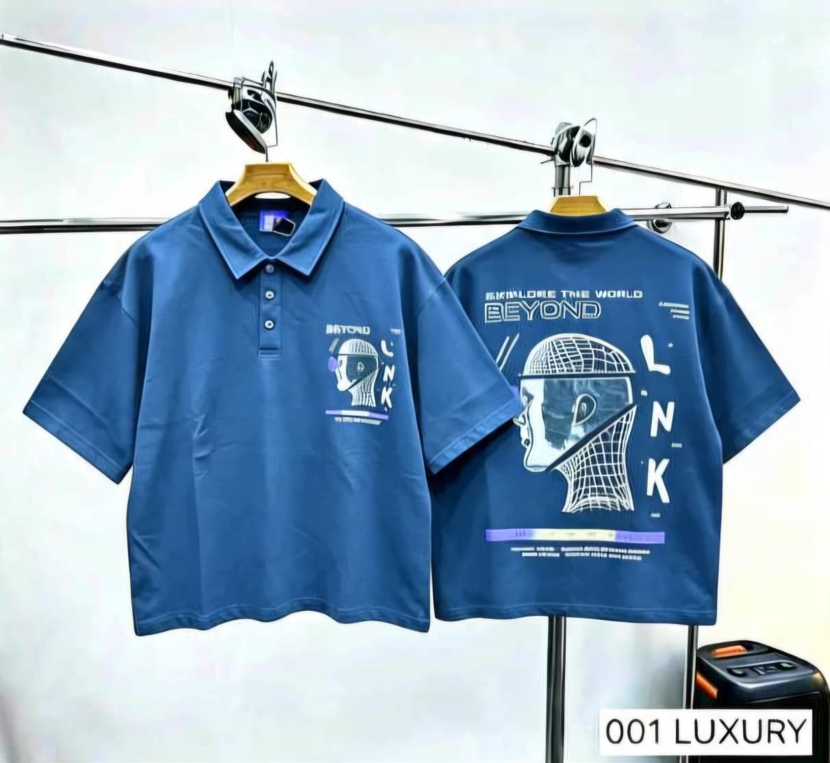 Blue polo shirt front and back with LNK helmet graphic and Beyond text.