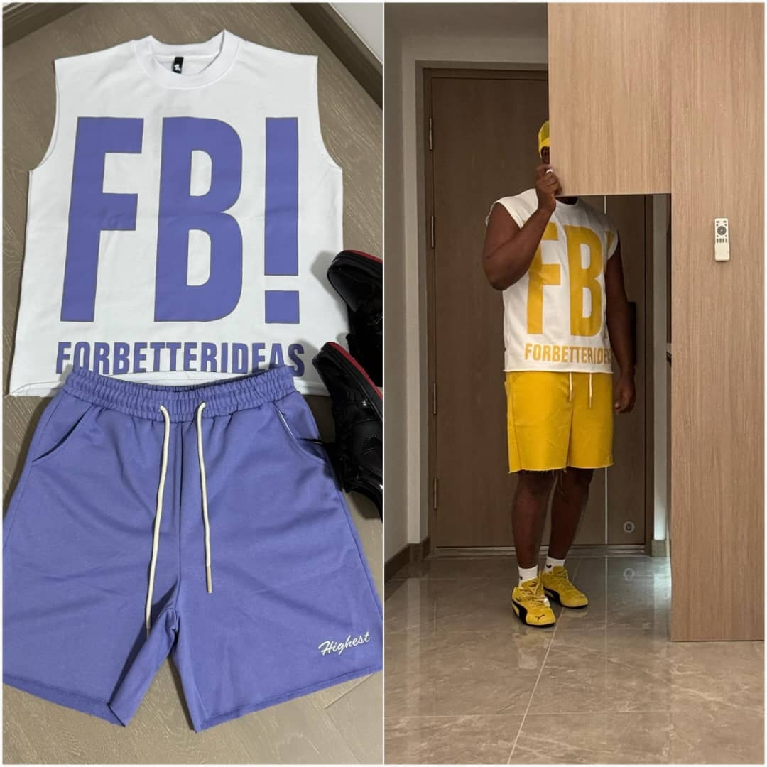 White sleeveless top with purple FB! graphic, purple shorts and black sneakers.