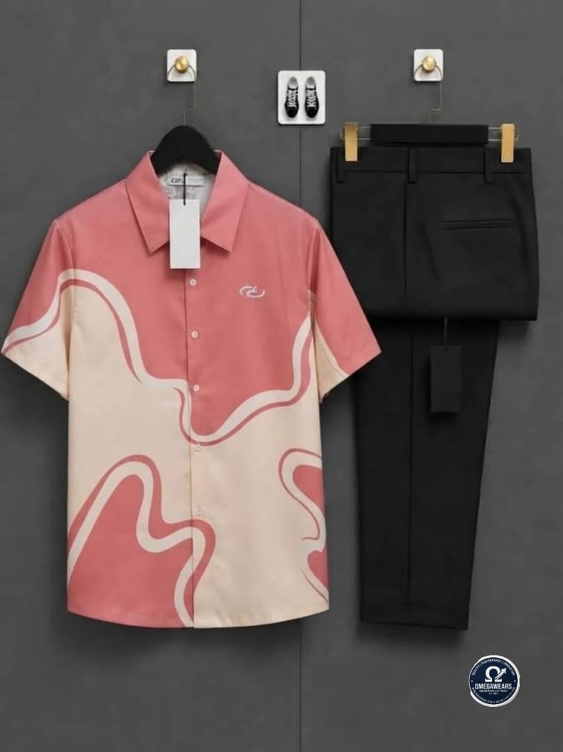 Pink and cream wave print short sleeve shirt paired with black trousers.