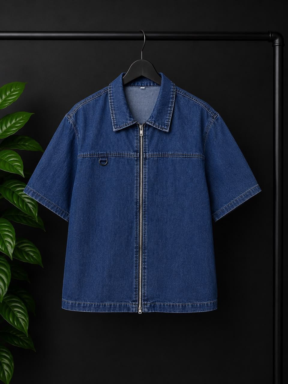 Blue denim short-sleeve zip-up shirt with collar and chest D-ring detail.