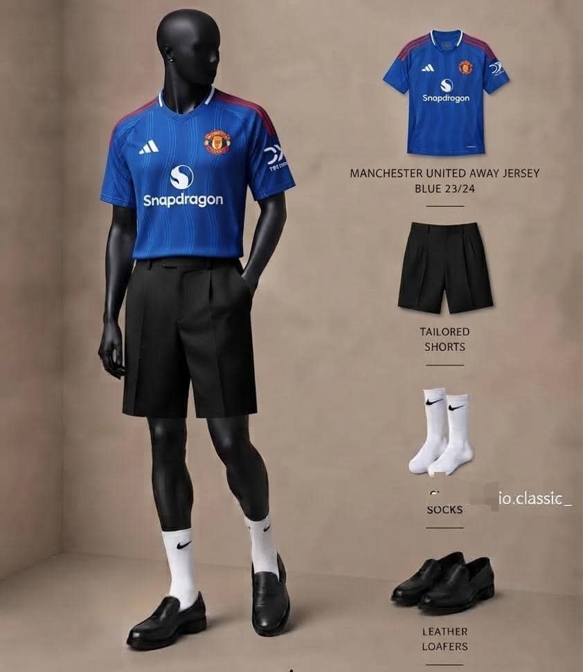 Mannequin in Manchester United blue jersey with black pleated shorts, socks and loafers.