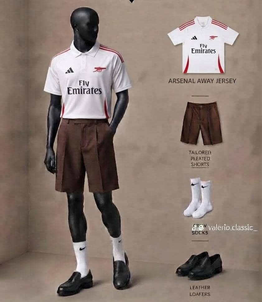 Mannequin in Arsenal away white jersey with brown pleated shorts, socks and loafers.