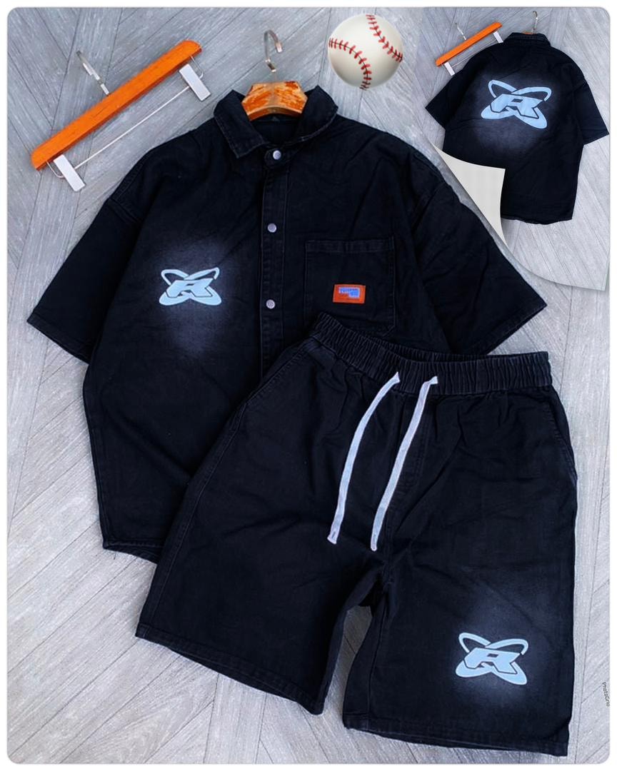 Flat lay of black denim shirt and shorts with blue spray logo print and small shirt inset.