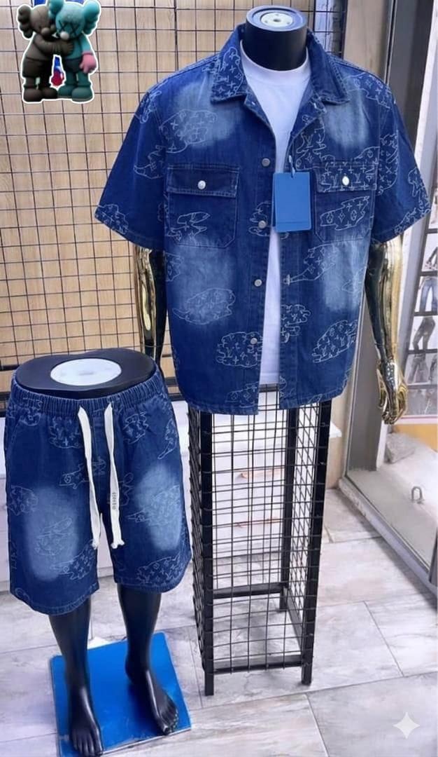 Mannequin styled in blue denim shirt and shorts featuring white outline repeating prints.