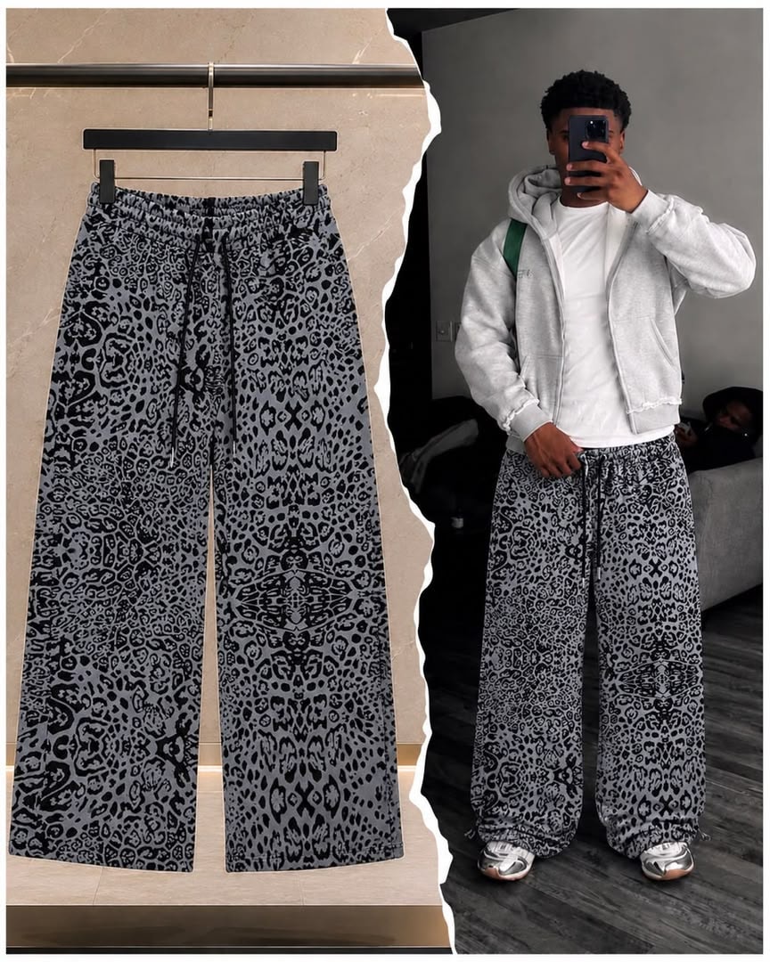 Gray abstract print wide-leg joggers on model wearing with hoodie.