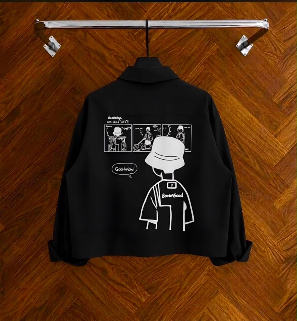 Back view of black cropped shirt with white comic graphic and Boom Good text.