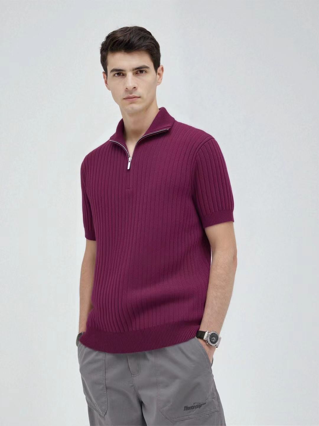 Man modeling burgundy ribbed quarter-zip polo shirt.