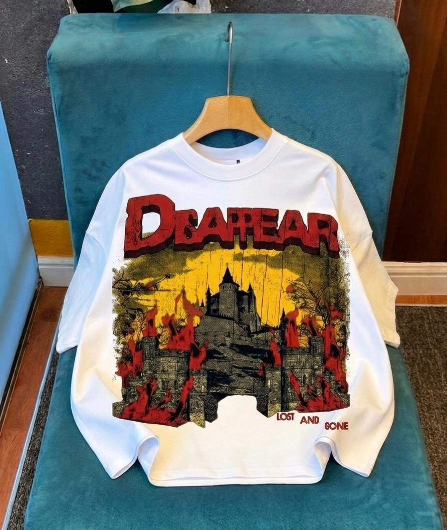White long sleeve top with Disappear castle graphic.