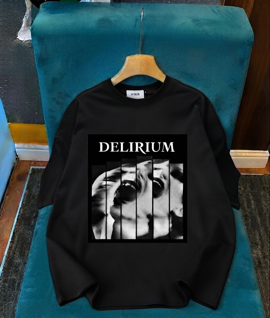 Black long sleeve top with Delirium split face graphic on chest.