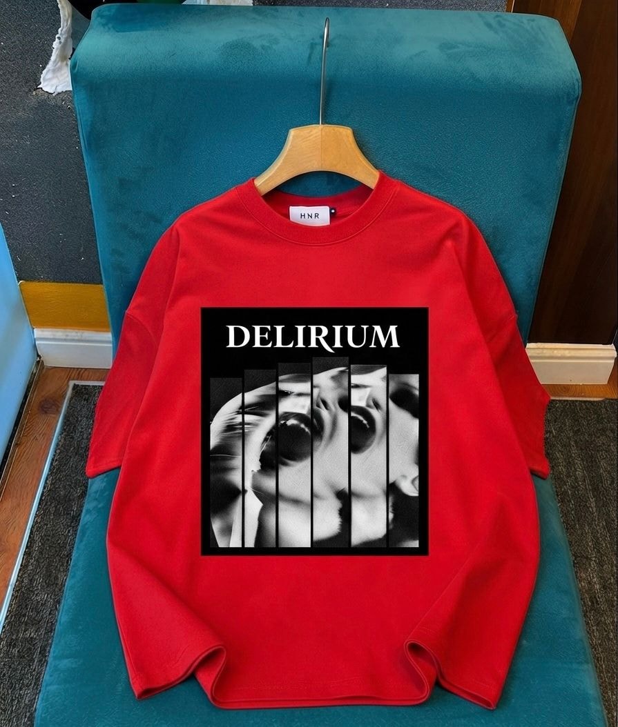 Red long sleeve top with Delirium split face graphic on chest.