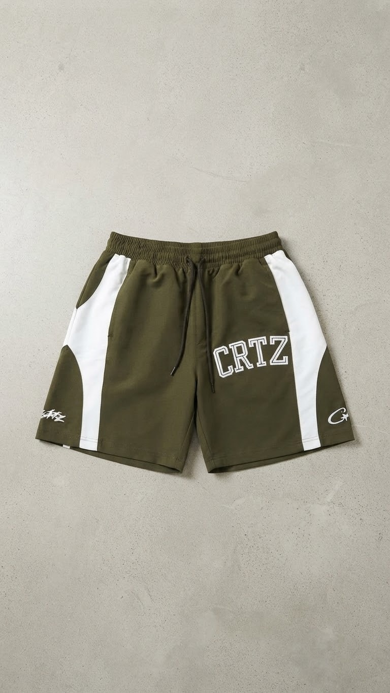 Olive green CRTZ printed contrast panel shorts on gray background.
