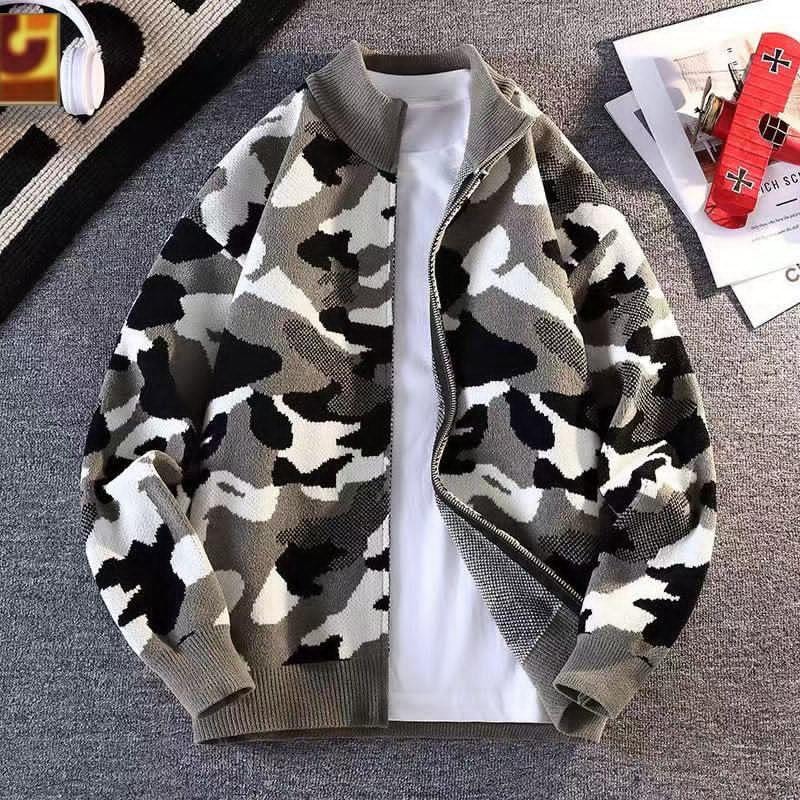 Camouflage knit bomber jacket in grey, black and white pattern over white tee.
