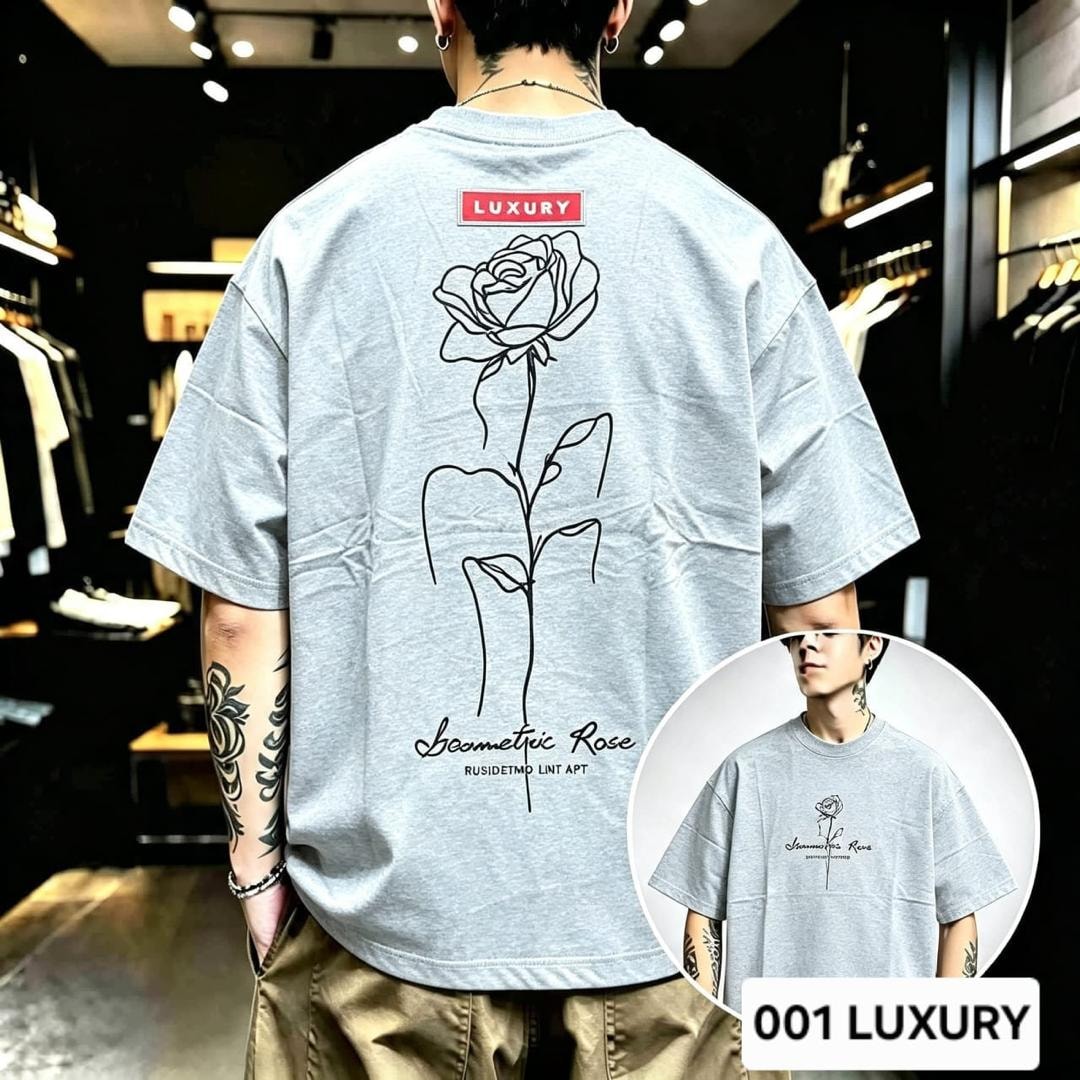 Man modeling gray oversized t-shirt with geometric rose line art on the back.